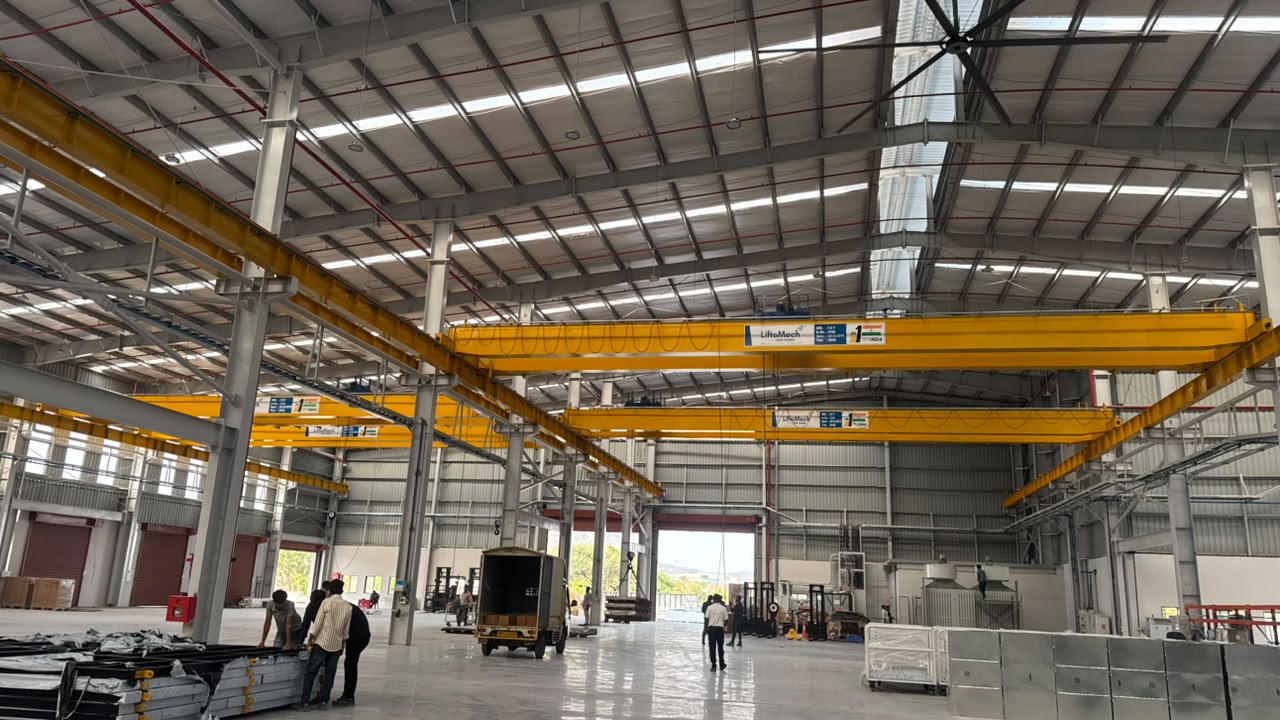 LiftoMech double girder EOT cranes operating across a modern manufacturing bay
