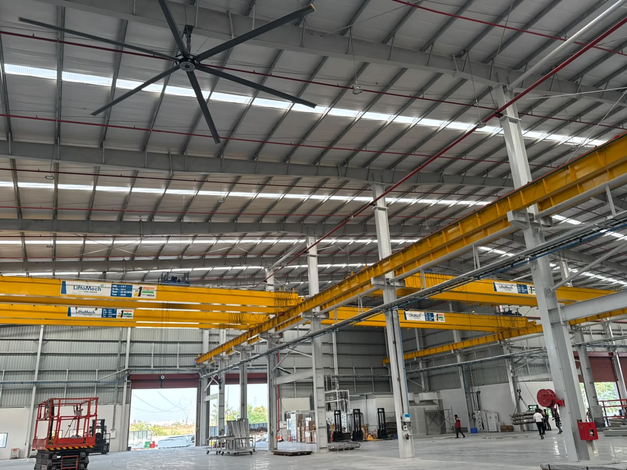 Multiple LiftoMech single girder EOT cranes in a large warehouse